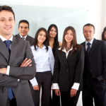 Human resources coordinator standing in front of happy staff