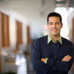 Consultant standing with his arms crossed