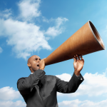 Man yelling into horn